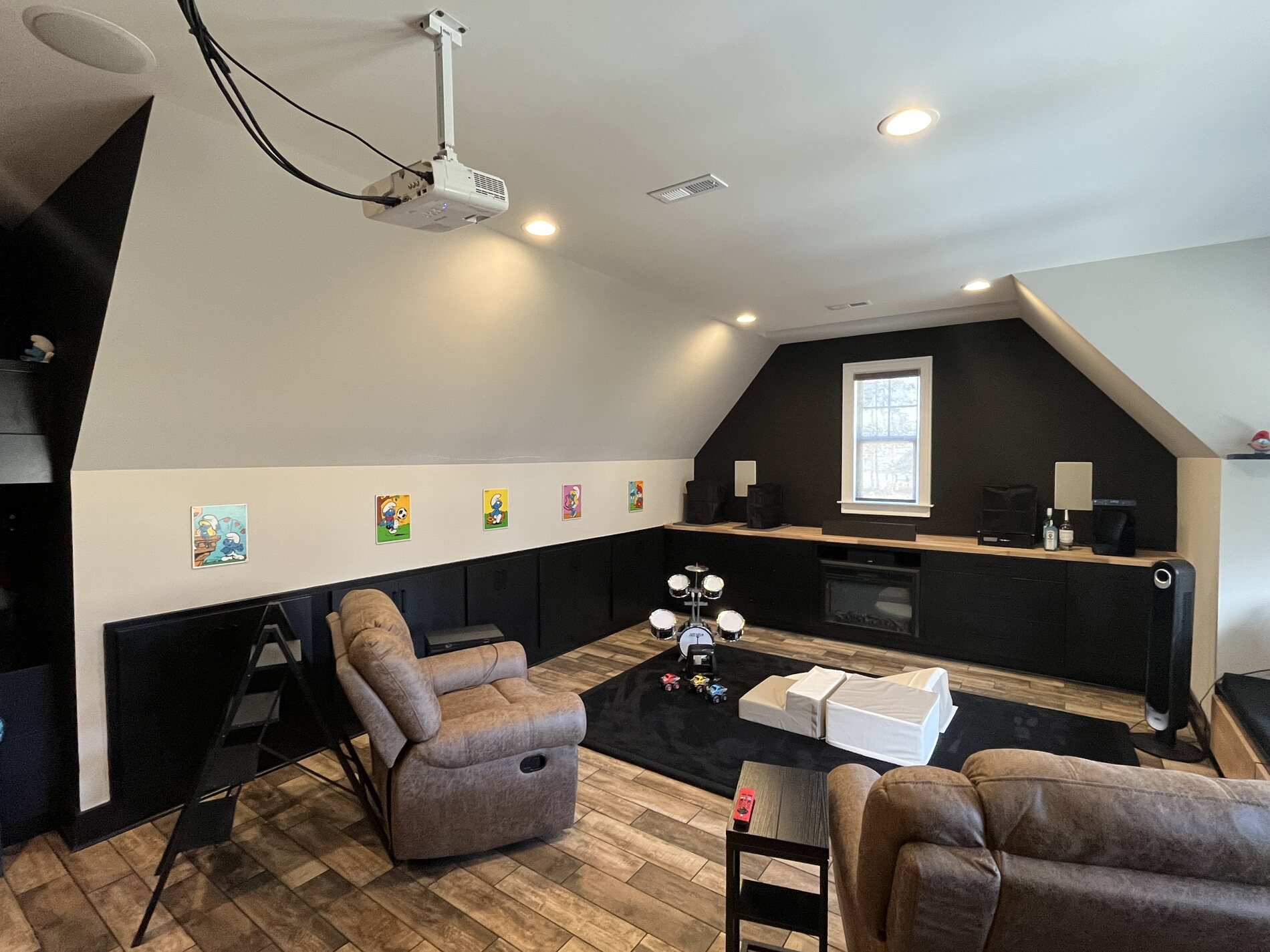Bonus room converted from bare studs into a finished media room with a wet bar