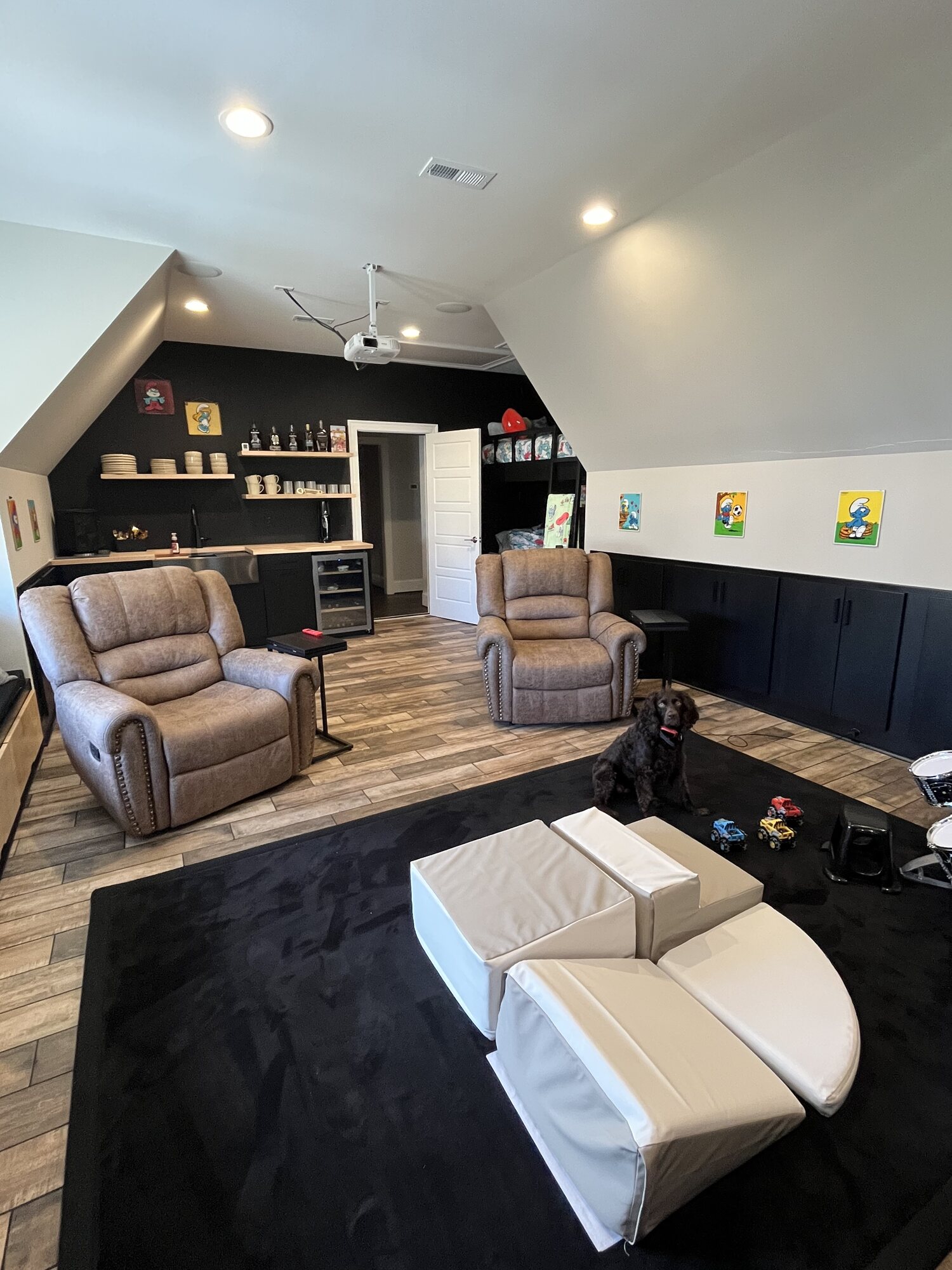 The bar wall with built in cabinetry and media storage