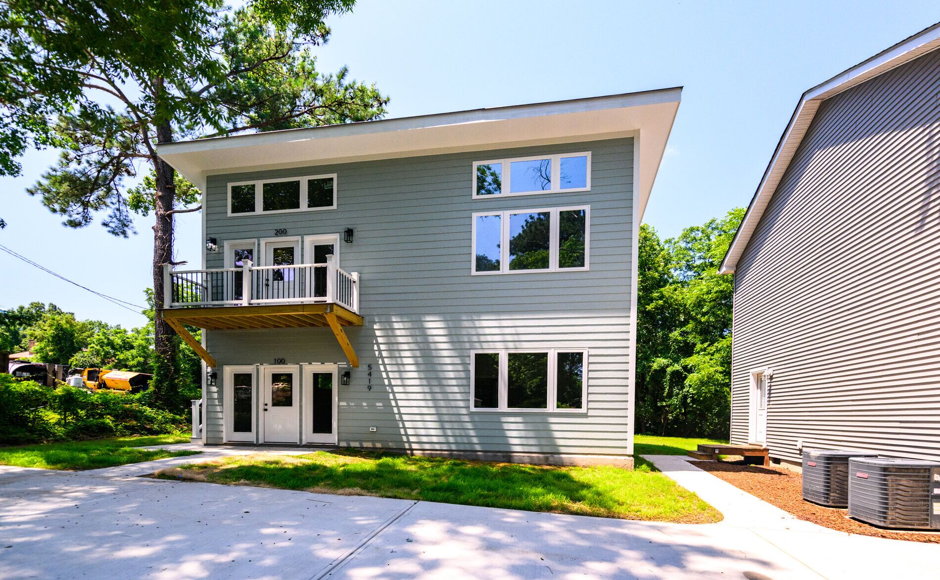 Duplex accessory dwelling unit exterior with balcony and exterior stairs