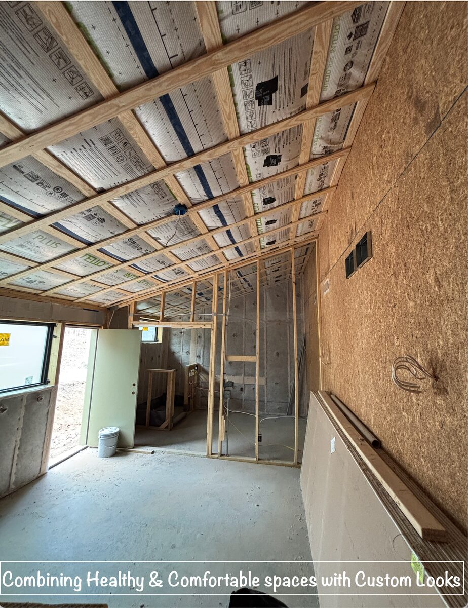 Ceiling framing and insulation in progress on a new construction home